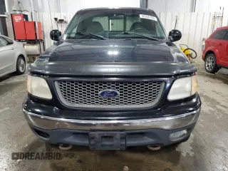 2000 Ford F-150 XL with VIN 1FTRX18L7YNA85909, listed as a Copart auction lot 56056165 with 134,765 mi miles and Salvage title. Bid and sale history available at DreamBid. Image 5.