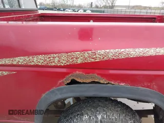 1996 Nissan Frontier XE z VIN 1N6SD11Y6TC355732, wystawiony jako IAAI lot #41958249 z przebiegiem 110 419 mil mil oraz . Historia ofert i sprzedaży dostępna na DreamBid. Obrazek 12.