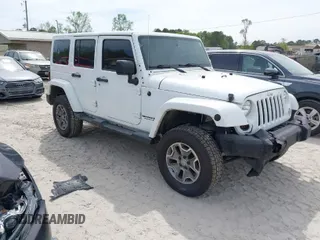 2015 Jeep Wrangler Unlimited Rubicon Hard Rock with VIN 1C4HJWFG7FL684057, listed as a IAAI auction lot 41963885 with 103,240 mi miles and . Bid and sale history available at DreamBid. Image 1.