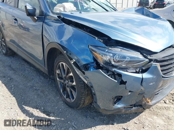 2016 Mazda CX-5 Grand Touring with VIN JM3KE4DY0G0629924, listed as a IAAI auction lot 41878154 with 78,196 mi miles. Bid and sale history available at carsss.com. Image 17.