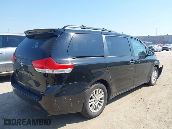 2014 Toyota Sienna XLE with VIN 5TDYK3DC2ES492554, listed as a IAAI auction lot 41685109 with 196,619 mi miles and . Bid and sale history available at DreamBid. Image 4.