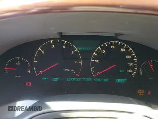 2003 Cadillac DeVille DTS z VIN 1G6KF579X3U233215, wystawiony jako Copart lot #48636775 z przebiegiem 99 144 mil mil oraz Nie do naprawy. Historia ofert i sprzedaży dostępna na DreamBid. Obrazek 9.