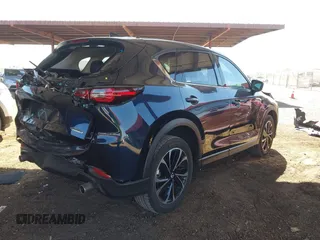 2023 Mazda CX-5 2.5 S Premium Plus Package with VIN JM3KFBEM3P0125736, listed as a IAAI auction lot 41578619 with 18,560 mi miles. Bid and sale history available at carsss.com. Image 4.