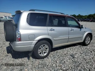2004 Suzuki XL7 LX z VIN JS3TY92V144105911, wystawiony jako Copart lot #56744425 z przebiegiem 253 975 mil mil oraz Szkoda całkowita • Salvage title. Historia ofert i sprzedaży dostępna na DreamBid. Obrazek 3.