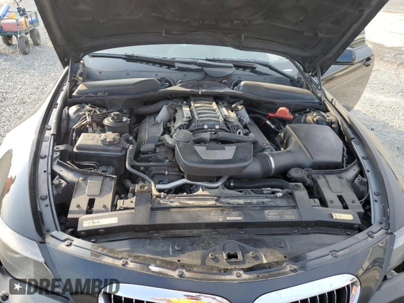 2007 BMW 6 Series 650i z VIN WBAEH13577CR52351, wystawiony jako Copart lot #72886154 z przebiegiem 77 410 mil mil oraz Szkoda całkowita • Salvage title. Historia ofert i sprzedaży dostępna na DreamBid. Obrazek 11.
