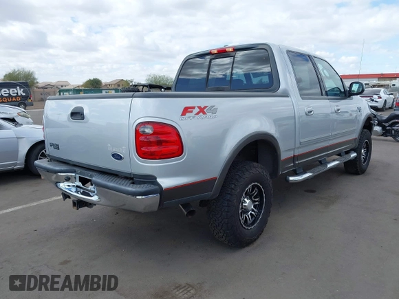 2003 Ford F-150 XLT with VIN 1FTRW08LX3KC79700, listed as a IAAI auction lot 41680562 with 131,052 mi miles. Bid and sale history available at carsss.com. Image 4.