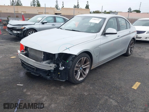 2017 BMW 3 Series 330e iPerformance with VIN WBA8E1C59HK480327, listed as a IAAI auction lot 41809395 with 74,919 mi miles. Bid and sale history available at carsss.com. Image 2.