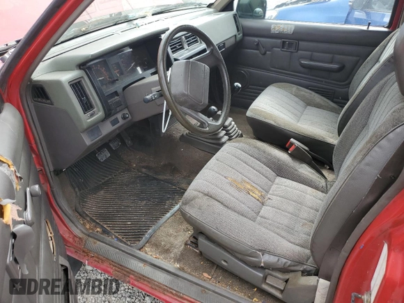 1989 Nissan Hardbody E z VIN 1N6ND16Y9KC352795, wystawiony jako Copart lot #72202814 z przebiegiem 242 396 mil mil oraz Tytuł czysty. Historia ofert i sprzedaży dostępna na DreamBid. Obrazek 8.