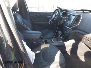2015 Jeep Cherokee Trailhawk with VIN 1C4PJMBSXFW687737, listed as a IAAI auction lot 40963392 with 119,805 mi miles. Bid and sale history available at carsss.com. Image 5.