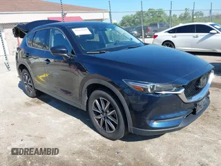2018 Mazda CX-5 Grand Touring with VIN JM3KFBDMXJ0326025, listed as a IAAI auction lot 42634649 with 129,411 mi miles and . Bid and sale history available at DreamBid. Image 1.