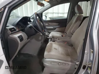 2016 Honda Odyssey SE with VIN 5FNRL5H31GB109718, listed as a Copart auction lot 54689915 with 48,933 mi miles and Salvage Title. Bid and sale history available at DreamBid. Image 7.