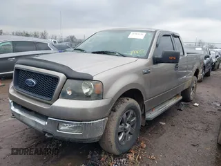 2004 Ford F-150 XLT with VIN 1FTPX14524NA34164, listed as a IAAI auction lot 41583236 with 168,780 mi miles. Bid and sale history available at carsss.com. Image 2.