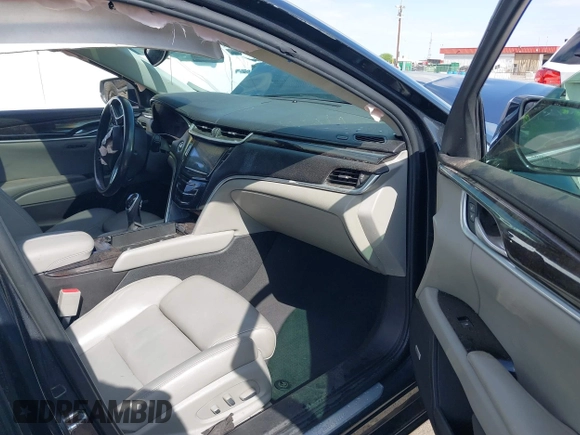 2013 Cadillac XTS Luxury with VIN 2G61P5S31D9182553, listed as a IAAI auction lot 42076227 with 116,849 mi miles and . Bid and sale history available at DreamBid. Image 5.