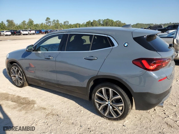 2021 BMW X2 xDrive28i with VIN WBXYJ1C04M5S07696, listed as a Copart auction lot 73412384 with 35,004 mi miles and Salvage Title. Bid and sale history available at carsss.com. Image 2.