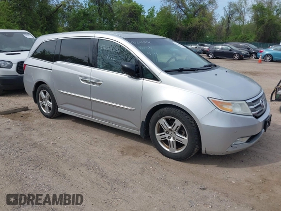 2012 Honda Odyssey Touring with VIN 5FNRL5H92CB055473, listed as a IAAI auction lot 42128601 with 163,901 mi miles. Bid and sale history available at carsss.com. Image 1.