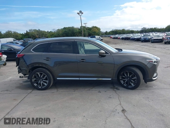 2017 Mazda CX-9 Grand Touring with VIN JM3TCADY7H0133092, listed as a IAAI auction lot 41133652 with 233,454 mi miles and . Bid and sale history available at DreamBid. Image 14.