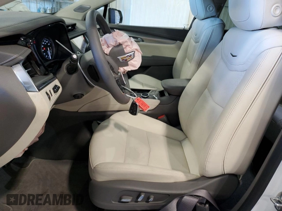 2025 Cadillac XT5 FWD Premium Luxury with VIN 1GYKNCRSXSZ106707, listed as a Copart auction lot 86919854 with 1,879 mi miles and Salvage Title. Bid and sale history available at DreamBid. Image 7.
