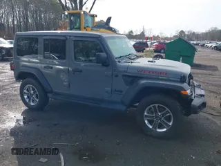 2021 Jeep Wrangler Unlimited Willys Sport with VIN 1C4HJXDGXMW767633, listed as a IAAI auction lot 41700168 with 37,994 mi miles and . Bid and sale history available at DreamBid. Image 13.