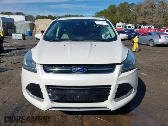 2014 Ford Escape Titanium with VIN 1FMCU9JX7EUD17335, listed as a IAAI auction lot 41302107 with 104,352 mi miles and . Bid and sale history available at DreamBid. Image 11.