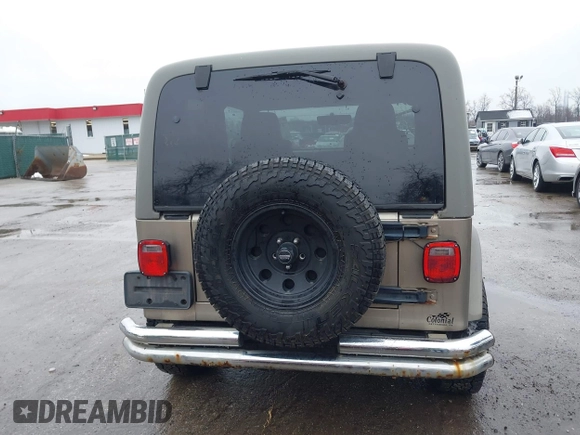 2006 Jeep Wrangler Sport Right Hand Drive with VIN 1J4F449S06P725862, listed as a IAAI auction lot 41562989 with 121,997 mi miles. Bid and sale history available at carsss.com. Image 16.