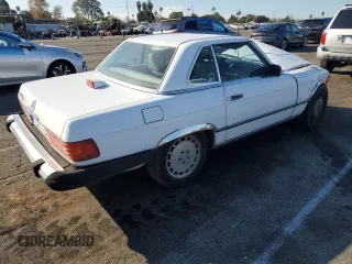 1987 Mercedes-Benz 560 SL with VIN WDBBA48D8HA066224, listed as a Copart auction lot 87976835 with 196,054 mi miles and Salvage Title. Bid and sale history available at DreamBid. Image 3.
