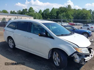 2012 Honda Odyssey Touring with VIN 5FNRL5H96CB015848, listed as a IAAI auction lot 42604470 with 126,145 mi miles and . Bid and sale history available at DreamBid. Image 1.