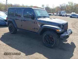 2021 Jeep Wrangler Unlimited Willys with VIN 1C4HJXDG1MW672507, listed as a IAAI auction lot 42084805 with 59,943 mi miles and . Bid and sale history available at DreamBid. Image 1.