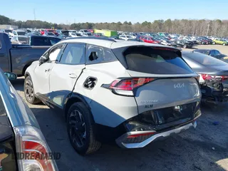 2023 Kia Sportage SX-Prestige z VIN 5XYK53AF7PG133325, wystawiony jako IAAI lot #41278082 z przebiegiem 26 361 mil mil oraz . Historia ofert i sprzedaży dostępna na DreamBid. Obrazek 3.