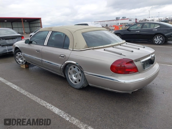 2001 Lincoln Continental with VIN 1LNHM97VX1Y627039, listed as a IAAI auction lot 41482016 with 143,317 mi miles and . Bid and sale history available at DreamBid. Image 3.