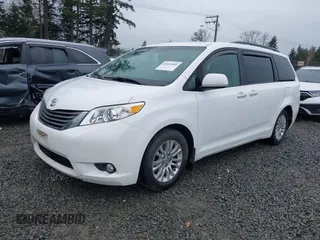 2014 Toyota Sienna XLE with VIN 5TDYK3DC2ES485846, listed as a IAAI auction lot 41693092 with 106,156 mi miles and . Bid and sale history available at DreamBid. Image 2.