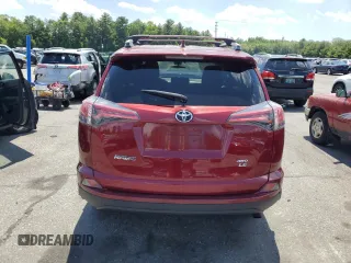 2018 Toyota RAV4 LE with VIN 2T3BFREVXJW838680, listed as a Copart auction lot 61452055 with 79,016 mi miles and Salvage title. Bid and sale history available at DreamBid. Image 6.