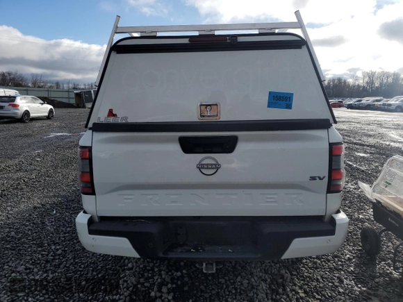 2024 Nissan Frontier SV with VIN 1N6ED1FJXRN637443, listed as a Copart auction lot 49068835 with 6,600 mi miles and Salvage title. Bid and sale history available at DreamBid. Image 6.