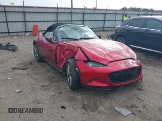2021 Mazda MX-5 Miata Grand Touring with VIN JM1NDAD79M0454079, listed as a IAAI auction lot 41230199 with 104,783 mi miles and . Bid and sale history available at DreamBid. Image 1.