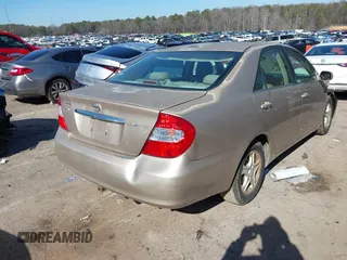 2002 Toyota Camry LE z VIN 4T1BE32K02U051709, wystawiony jako IAAI lot #41485620 z przebiegiem 232 876 mil mil oraz . Historia ofert i sprzedaży dostępna na DreamBid. Obrazek 4.