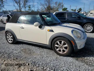 2010 MINI Convertible with VIN WMWMR3C55ATU97172, listed as a Copart auction lot 42726215 with 99,164 mi miles and Salvage Title. Bid and sale history available at DreamBid. Image 4.
