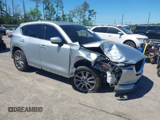2019 Mazda CX-5 Grand Touring with VIN JM3KFADM1K1606082, listed as a IAAI auction lot 41875878 with 66,089 mi miles. Bid and sale history available at carsss.com. Image 1.