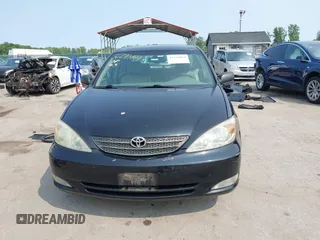 2003 Toyota Camry LE z VIN 4T1BE30KX3U197331, wystawiony jako IAAI lot #42298164 z przebiegiem 248 008 mil mil oraz . Historia ofert i sprzedaży dostępna na DreamBid. Obrazek 12.