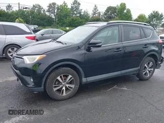 2018 Toyota RAV4 XLE with VIN 2T3WFREVXJW501296, listed as a IAAI auction lot 42358130 with 163,669 mi miles and . Bid and sale history available at DreamBid. Image 2.