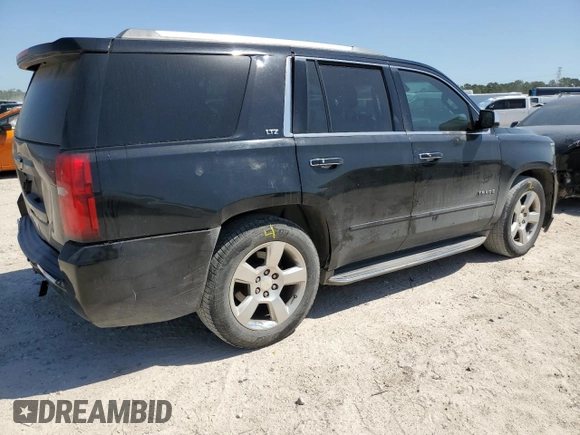 2015 Chevrolet Tahoe LTZ z VIN 1GNSCCKC7FR237119, wystawiony jako Copart lot #52712625 z przebiegiem 264 359 mil mil oraz Szkoda całkowita • Salvage title. Historia ofert i sprzedaży dostępna na DreamBid. Obrazek 3.