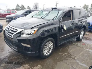 2014 Lexus GX 460 with VIN JTJBM7FX6E5073973, listed as a IAAI auction lot 41610332 with 128,870 mi miles. Bid and sale history available at carsss.com. Image 2.