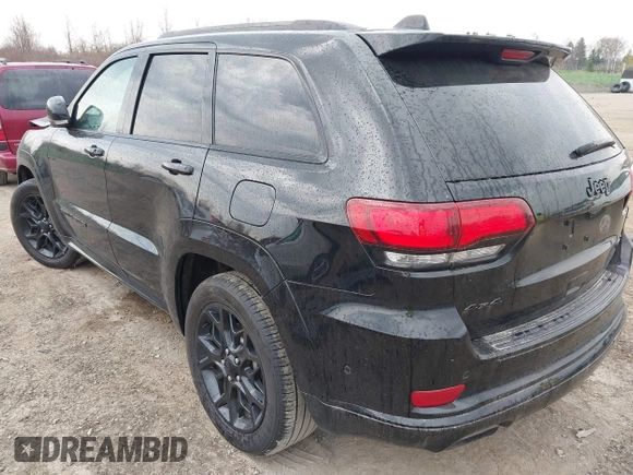 2021 Jeep Grand Cherokee 80th Anniversary with VIN 1C4RJFBG7MC828116, listed as a IAAI auction lot 42118355 with 57,240 mi miles and . Bid and sale history available at DreamBid. Image 3.