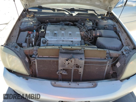 2003 Cadillac DeVille DHS z VIN 1G6KE54Y13U124690, wystawiony jako Copart lot #73757984 z przebiegiem 101 286 mil mil oraz Szkoda całkowita • Salvage title. Historia ofert i sprzedaży dostępna na DreamBid. Obrazek 11.
