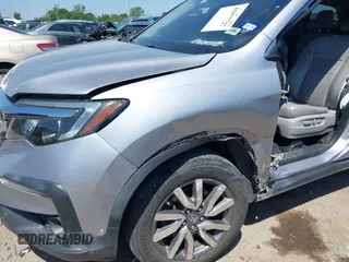 2019 Honda Pilot EX-L with VIN 5FNYF5H58KB040331, listed as a IAAI auction lot 41977727 with 90,655 mi miles and . Bid and sale history available at DreamBid. Image 6.