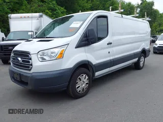 2016 Ford Transit Cargo z VIN 1FTYR2ZM6GKA03946, wystawiony jako IAAI lot #42590477 z przebiegiem 163 710 mil mil oraz . Historia ofert i sprzedaży dostępna na DreamBid. Obrazek 2.