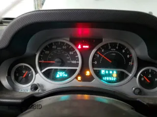 2009 Jeep Wrangler Sahara z VIN 1J4FA54189L789642, wystawiony jako Copart lot #89078145 z przebiegiem 128 902 mil mil oraz Szkoda całkowita • Salvage title. Historia ofert i sprzedaży dostępna na DreamBid. Obrazek 9.