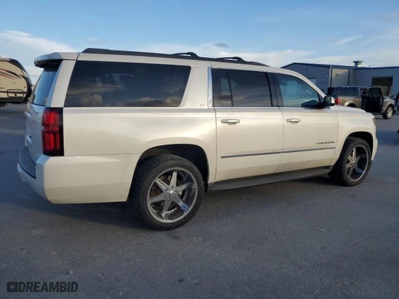 2015 Chevrolet Suburban LT with VIN 1GNSKJKC2FR638780, listed as a Copart auction lot 47360345 with 156,884 mi miles and Salvage Title. Bid and sale history available at carsss.com. Image 3.