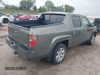 2007 Honda Ridgeline RTL with VIN 2HJYK16517H513832, listed as a IAAI auction lot 42626411 with 209,171 mi miles and . Bid and sale history available at DreamBid. Image 4.