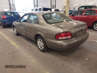 1999 Mazda 626 ES with VIN 1YVGF22C1X5852798, listed as a IAAI auction lot 41736489 with 136,536 mi miles. Bid and sale history available at carsss.com. Image 3.