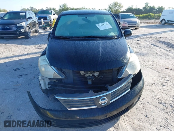 2009 Nissan Versa 1.8 SL with VIN 3N1BC13E79L476570, listed as a IAAI auction lot 41804750 with 160,449 mi miles. Bid and sale history available at carsss.com. Image 12.