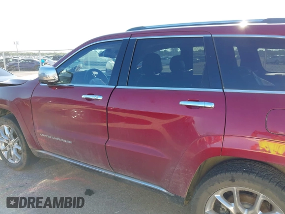 2015 Jeep Grand Cherokee Summit with VIN 1C4RJEJG9FC100568, listed as a IAAI auction lot 42512705 with 128,413 mi miles and . Bid and sale history available at DreamBid. Image 14.